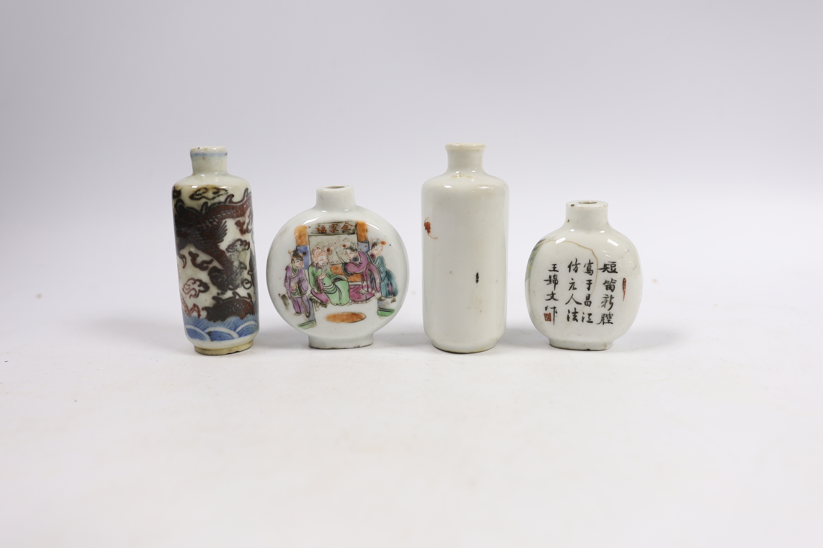 Three 19th century Chinese famille rose snuff bottles, and an underglaze copper red ‘Dragon’ snuff bottle, tallest 9cm